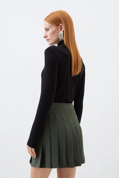 A classic mini skirt style is elevated with this piece, crafted from crepe fabric for a soft touch while an embellished tab detail sits at the waist. Finished with a playful mini hem and classic pleats, this piece forms the foundation for many elevated ensembles that can be worn all year round.Mini skirtCrepeTab detailPleated Elegant Lined Skort For Fall, Elegant Fall Skort With Lined Skirt, Elegant Elastane Pleated Mini Skirt, Elegant Pleated Mini Skort, Elegant Short Skort For Fall, Elegant Short Length Skort For Fall, Elegant Mini Hem Relaxed Skirt Skort, Elegant Mini Hem Skort For Spring, Elegant Mini Pleated Skirt For Work