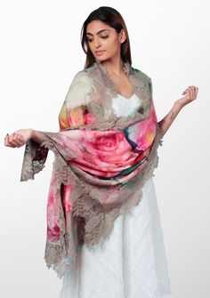 Immerse yourself in a world of romance and charm with this roses print scarf. The scarf features a delightful print of delicate roses, adding a touch of whimsy and elegance to your ensemble. Crafted from a blend of wool and silk, it offers a luxuriously soft and smooth feel against your skin. The scarf is further adorned with a sienna-colored floral lace border, showcasing intricate details and a graceful feminine flair. Wrap yourself in beauty and grace whilst keeping comfortably warm. Luxury Embroidered Silk Scarves, Beauty And Grace, Roses Print, Lace Border, Rose Print, In A World, Scarf Print, Intricate Details, Silk Scarf