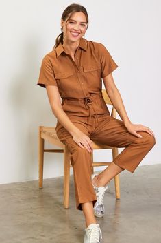 If you need an outfit that will have you ready in 30 seconds, opt for this utility jumpsuit. It's basically effortless, designed with short sleeves, multiple pockets, and a drawstring waist to define the shape. •Pointed collar •Buttoned half placket •Utility pockets •Elasticized waist •Adjustable drawstring Item Number: 74374 Tan Jumpsuit Outfit, Utility Jumpsuit Outfit, Fall Jumpsuit Outfit, Tan Jumpsuit, Beige Jumpsuit, Ginger Brown, Jumpsuit Fall, Short Sleeve Jumpsuit, Utility Jumpsuit