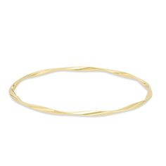 Graceful and elegant, this fashion bangle bracelet is a great day or evening wardrobe choice. Crafted in warm 14K gold, this polished design is gently twisted for a shimmering look. Wear two or more together for a bohemian chic look. Buffed to a bril Elegant Twisted Jewelry With Polished Finish, Elegant Hoop Bangle With Polished Finish, Adjustable Yellow Gold Flexible Bangle, Adjustable Flexible Yellow Gold Bangle, Modern Twist Yellow Gold Bangle Bracelet, Elegant 14k Yellow Gold Bangle, Yellow Gold Flexible Bangle Bracelet, Flexible Yellow Gold Bangle Bracelets, Adjustable Yellow Gold Bracelets With A Modern Twist