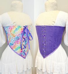 This corset is inspired by a classic shape with a few modern twists On one side the corset is a Rainbow Galaxy Star Print Cotton and Lilac Corduroy Laced with a matching 8m cotton cord in a way that facilitates the swapping between the two sides with ease.  A fabulous addition to any wardrobe and made of 80% recycled fabrics This is a finished item available in only one size, it's closed measurements are Bust -  37" Waist-  34" Size approximately XL if you are unsure about sizing or have any oth Fitted Corset With Corset Back For Festivals, Fitted Corset For Festival, Fitted Corset Back Dress For Festival, Fitted Corset Belt With Corset Back For Festivals, Fitted Underbust Cotton Corset, Cotton Corset With Fitted Bodice And Corset Back, Fitted Underbust Corset Belt For Festivals, Fitted Purple Corset With Boned Bodice, Purple Fitted Underbust Corset