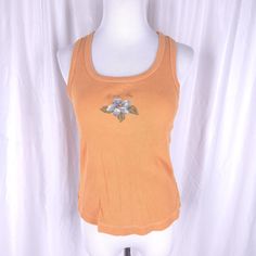 Vintage y2k orange ribbed Hang Ten tank top. In excellent vintage condition. Tag size large.  Measurements (laying flat) Chest 15 inches underarm to underarm Length 21 inches top of shoulder to bottom hem Orange Ribbed Sleeveless Top, Y2k Tank Top For Beach, Y2k Tank Top For The Beach, Y2k Style Tank Top For The Beach, Y2k Style Ribbed Tank Top For Summer, Orange Ribbed Summer Tops, Summer Y2k Orange Top, Orange Y2k, Y2k Shirts