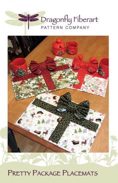 three placemats with bows on them sitting on top of a table next to cups and saucers