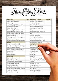 a hand holding a pen over a printable photography checklist on top of a wooden table