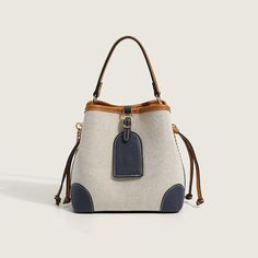 Description:Going out and about in the town is even better with this gorgeous bag! Made of PU leather and canvas. embellished with twin drawstrings to the side. featuring a magnetic buckle closure to the top along with a detachable strap. an interior zipper pocket. Find more trendy women's bucket bags or unique bags in our boutique. and elevate your daily look with our accessories. Size One Size(in) One Size(cm) Length 8.7 22.0 Height 7.9 20.0 Width 4.7 12.0 Flower Midi Dress, Bucket Bags, Leather And Canvas, In The Town, Unique Bags, Print Trends, Gorgeous Bags, Red Mini Dress, Out And About