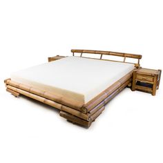 a bamboo bed frame with two drawers on each side and a white mattress in the middle