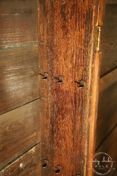 an old wooden door with rivets on it