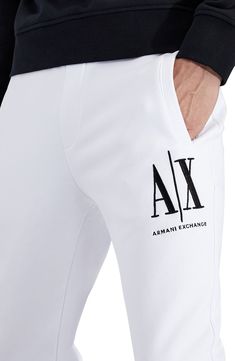 Dimensional Armani Exchange embroidery tops one leg of sweatpants knit from soft, breathable cotton in a fit that stays close for easy-moving comfort. Elastic waist with internal drawcord Front welt pockets; back welt pocket Banded cuffs 100% cotton Machine wash, tumble dry Imported Men's Clothing Sports Cotton Pants With Logo Print, Logo Waistband Athleisure Sweatpants, Athleisure Sweatpants With Logo Waistband, Cotton Bottoms With Logo For Loungewear, Logo Cotton Pants For Streetwear, Casual Logo Pants For Streetwear, Cotton Sportswear Bottoms With Logo Print, Cotton Athleisure Bottoms With Logo Print, Athleisure Cotton Bottoms With Logo Print