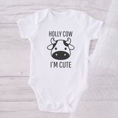 Cute Baby Onesie® Holly Cow I'm Cute Onesie® Favorite Onesie® Baby Onesie® Fancy Baby Onesie® Short Sleeve Onesie® Our amazing Holly Cow I'm Cute Onesie® Onesie® Favorite Onesie® is made of Gerber organic interlocking knit 100% cotton ultra-soft fabrics and CPSIA compliant. HOW TO ORDER Choose the baby body suit size, refer at our sizing chart below. For personalized baby body suit, enter your customization or desired information you would like in the ADD YOUR PERSONALIZATION box. ADD TO CART an Boy Onesies, Cute Onesie, Gerber Organic, Boy Onesie, Gender Neutral Baby Clothes, Baby Body, Gender Neutral Baby, Cricut Ideas, Unisex Baby