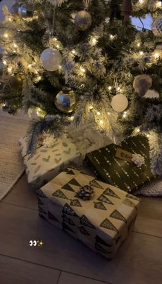 presents under the christmas tree with lights