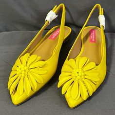 Isaac Mizrahi Gladiola Slingback Flats With Flower In Yellow; Size 6. Never Worn And Comes With Original Packaging (No Box But Will Ship In Plastic Storage Box); Smoke-Free Home Yellow Pointed Toe Slingback Pumps For Spring, Spring Yellow Slingback Strap Pumps, Spring Yellow Slingback Pumps With Heel Strap, Yellow Slingback Pumps With Heel Strap For Spring, Spring Flat Slingback Pumps With Heel Strap, Spring Evening Slingback Slip-on Sandals, Spring Yellow Slingback Pumps, Spring Evening Slip-on Slingback Sandals, Spring Evening Slip-on Slingback Pumps