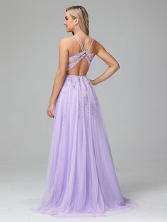 a woman in a purple dress is looking back