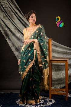 This is pure silk handloom chanderi gold zari border and pallu. The bottle green color with handmade leaf  motif all over  pure gold zari border and pallu adds extra royalness in it. Green Chanderi Saree With Zari Work, Green Chanderi Dupatta With Zari Work, Festive Dark Green Traditional Wear With Pallu, Green Zari Work Tussar Silk Traditional Wear, Green Tussar Silk Traditional Wear With Zari Work, Green Chanderi Dupatta With Pallu, Green Traditional Wear In Tussar Silk With Zari Work, Traditional Dark Green Dupatta With Zari Work, Dark Green Traditional Wear With Cutdana For Festivals