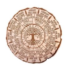 the tree of life is engraved on a wooden plaque