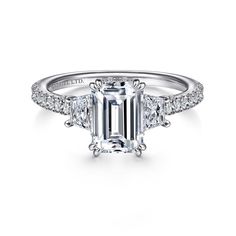 an emerald - cut diamond ring with three side stones on the shan shan shan shan shan shan shan shan shan shan shan shan shan shan shan shan shan shan shan shan shan shan shan shan shan shan shan shan shan