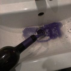 a bottle that is sitting in the sink