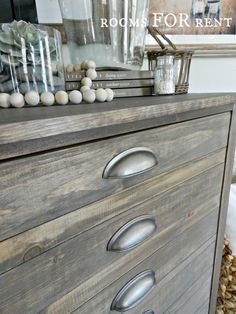 a dresser with drawers and knobs on it