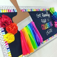 a bulletin board with colorful paper flowers and a paint brush on it that says, get ready for the school year