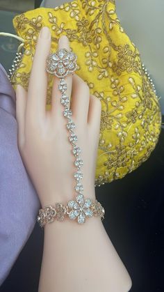 "Elevate your bridal look with our exquisite Rosegold Diamond Hand Jewelry. Featuring high-quality CZ haathphool, this piece is perfect for weddings, haldi parties, or sangeet events. Enhance your style with this luxurious, sparkling accessory designed to make you shine on your special day." All our products are crafted using traditional skills from our rich heritage. The manual nature of these crafts means that irregularities or variations may inherent in the handcrafting process. Bad Makeup, Diamond Bracelet Design, Wedding Hair Inspiration, Indian Wedding Jewelry, Bridal Look, Hand Jewelry, Rose Gold Diamonds, Bridal Looks, Chain Link Bracelet