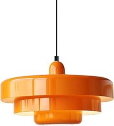 an orange pendant light hanging from a ceiling