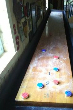 several bowling balls are scattered on the floor