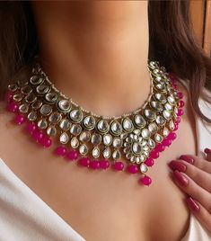 Adorn yourself in timeless elegance with this exquisite hot pink Kundan necklace set, perfect for weddings and special occasions. Crafted with meticulous attention to detail, the set features vibrant hot pink  hues reminiscent of Pakistani and Punjabi traditions, with a touch of Bollywood glamour. Complete with matching earrings and a stunning maangtika, this Indian Kundan ensemble effortlessly captures the essence of sophistication and grace. Measurements:  Weight- 110gms  Necklace Length-14" ( Luxury Pink Kundan Necklace For Wedding, Elegant Luxury Pink Kundan Necklace, Bollywood Glamour, Bollywood Jewelry, Kundan Necklaces, Wedding Jewelry Sets, Matching Earrings, Necklace Set, Timeless Elegance