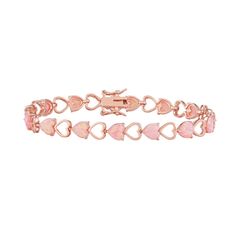 "Featuring heart shaped opals and rose gold-over-silver open heart links, this lovely piece is a stylish take on the classic tennis bracelet.BRACELET DETAILSLength: 7.25 in.Clasp: boxMetal: sterling silverPlating: 14k rose goldPackaging: boxedSTONE DETAILSStone type: lab-created pink opalTotal weight: 3 3/8 ct.Shape: heartSetting: prongGemstones may have been treated to enhance their appearance. Special care may be required.  Size: 7.25"". Gender: female. Age Group: adult. Material: Gold Over St Rose Gold Heart Cut Bracelet For Valentine's Day, Silver Lab, Body Smells, Magic Bands, Jewelry Clasps, Opal Bracelet, Pink Jewelry, Pink Tone, Open Heart