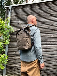 "Backpack in medium size made from waxed canvas in field tan with a volume outside pocket made in waxed canvas. I made it into an everyday backpack/rucksack, with waxed canvas padded straps. Roll to close top, and outside pocket with protective flap. The bottom is made in a double layer of waxed canvas for extra strength and durability . The bag closes with roll to close top and buckle and strap on the front in X-design made from vegetable tanned leather and easy acces on the backside with pouch Waxed Canvas Leather Backpack, Tan Backpack, Hipster Backpack, Waxed Canvas Backpack, Commuter Backpack, Everyday Backpack, Canvas Backpack, Waxed Canvas, I Made It