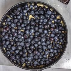 blueberries are in a pan on the stove top, ready to be cooked and eaten