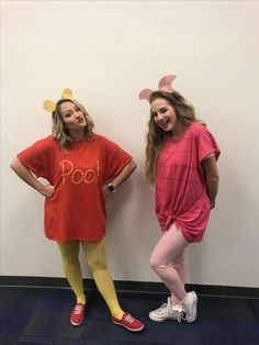 two girls dressed up as winnie the pooh and eeo from disney's pikachu