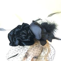 Fascinator Hat, Black Velvet, Silk Roses, Stripped Goose Feathers, a Marabou Wispy Feather. Head Band and Hair Clip. Black Bird Cage Veil. This fascinator is fun to add to your hairdo for any special occasion or just to dress up your look. Wear in your hair or on a hat for a glamorous touch. Floral Arrangement Adjusts on Headband. Remove from headband and clip into hair. For other vintage and homemade items see: www.VeryVictorianStudio.etsy.com For sewing related items see my other shop: www.Sew Elegant Black Mini Hat For Halloween, Elegant Black Halloween Mini Hats, Vintage Black Fascinator For Costume Party, Vintage Black Costume Accessories For Wedding, Elegant Black Hair Accessories For Costume Party, Vintage Black Fascinator Headband, Vintage Black Headband Fascinator, Elegant Black Headpiece For Costume, Elegant Black Costume Headpiece