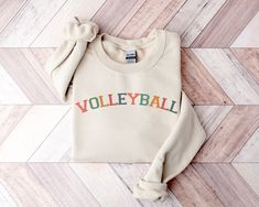 Volleyball Sweatshirt College Font Retro Sweatshirt Simple Varsity Letters Sweatshirt for Women Gift for Her Sport Sweater ❄ Unisex sizing ❄There are no itchy side seams on these sweaters. ❄ Made with a medium-heavy fabric blend of 50% cotton and 50% polyester, this sweatshirt feels cozy and is the perfect choice for those colder months. ❄ The classic fit along with the crew neckline deliver a comfy wearing experience with a clean-cut style. Meanwhile, the double-needle stitching at the shoulder Cheap Varsity Sweater For Campus, Affordable Varsity Sweater For Campus, Cheap Winter Varsity Sweatshirt, Cheap Varsity T-shirt For Summer, Cheap Varsity Sweatshirt For Sports Season, Cheap Varsity Long Sleeve Sweats, Cheap Women's Varsity Sweatshirt, Cheap White Varsity Sweater, Cheap Long Sleeve Varsity Sweats