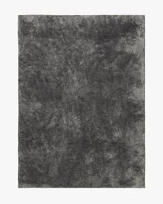 a gray area rug is shown in the shape of a square, with an uneven surface