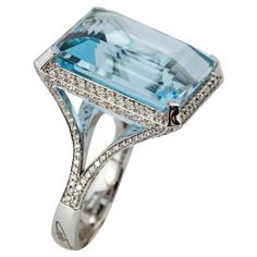 "Costis" Aquamarine Ring with 29.42 carats Aquamarine and Diamonds A simple, yet elegant setting to celebrate remarkable aquamarines. Every design is a challenge, starting from the highly demanding three-dimensional pieces, to the ostensibly simplest settings. Costis actually believes that what seems to be simple in appearance is the hardest to achieve. This does not mean less hours in the design room and in the workshop, but instead respect to the quality and value of the central gemstones. 18K White Gold. The ring features a 29.42 carats central stone surrounded with a total of 1.55 carats of Diamonds. Aquamarines remind Costis the hues of the Greek surroundings... the sea, the sky, the horizon... characteristics that he always uses in his pieces. Design Room, Aquamarine Ring, Aqua Marine, Aquamarine Rings, Cocktail Rings, Aquamarine, Three Dimensional, Diamond Ring, Jewelry Rings