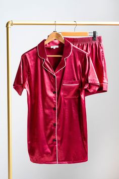 These ruby red satin pyjamas are perfect for lounging around and enjoying time at home! This luxurious two-piece pyjama set contains our signature white trim piping in a rich red satin colour. It includes both a short sleeve top with a traditional collar and pocket, and a pair of matching shorts with our elasticized waistband. Matching sets are available for pets! Silky Pajamas, Red Pajamas, Pyjama Satin, Matching Pjs, Adult Pajamas, Pyjama Sets, Stocking Fillers For Her, Nightwear Women, Matching Pajamas