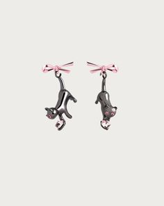 Discover our adorable Feline Pink Bow Earrings featuring a charming black cat design adorned with a delicate pink bow and a dainty pink heart. These enchanting accessories add a touch of whimsy to any outfit and make the perfect gift for cat lovers. Shop now and indulge in the irresistible combination of pink and feline elegance. Materials: Metal alloy, resin En Route Jewelry Earrings, Dangly Earrings Cartilage, Cat Earring, Earrings With Charms, Bow Earring, En Route Jewelry, Pink Accessories, Bow Jewelry, Bow Earrings