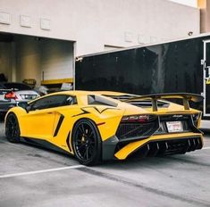 a yellow sports car parked in a parking lot