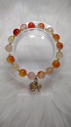 Sunset Serenade Crystal Glass Beads Bracelet with Gold Charms, Gold Chain, Crystal Heart Shape Glass Beads Charms. Each Charm is Random For Each Bracelet. Adjustable Heart Bracelet With Round Beads, Spiritual Crystal Bracelet With Heart And Round Beads, Bohemian Crystal Bracelet With Heart Beads, Bohemian Heart Bracelet With Colorful Round Beads, Heart-shaped Healing Beaded Bracelet, Heart-shaped Beaded Crystal Bracelet For Jewelry Making, Orange Heart Beads Beaded Bracelet As Gift, Orange Heart Beads Beaded Bracelet For Gift, Orange Beaded Bracelets With Heart Beads As Gift