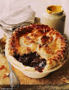 a pie sitting on top of a wooden cutting board