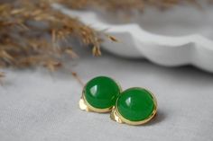 "Green jade clip on earrings gold, Ear clips, Green gold clip on earrings, Women clip on earrings, Gemstone clips, Birthday gift ideas. ⭐ Handmade cabochon ear clip on with a pair of gemstones Green Jade earrings. ⭐ Materials used:-  Clip On Earrings  * Green Jade Cabochons, jewelry glue,  * 12mm high quality gold plated stainless steel clip on earrings.  Matching Necklace  https://www.etsy.com/listing/1091395615/green-jade-necklace-gemstone-necklace ⭐ Also gemstone options are available in our Classic Green Clip-on Earrings As Gift, Gold Jade Wedding Earrings, Green Round Clip-on Earrings For Anniversary, Green Round Clip-on Earrings For Gift, Green Round Clip-on Earrings As Gift, Earrings Matching, Girls Clips, Ear Clips, Jade Earrings