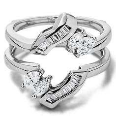 two tone gold and silver rings with diamonds on each ring, set in the shape of an arrow