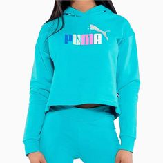 The Puma Women's Ess Cropped Logo Hoodie offers a comfortable and stylish choice for your workout wardrobe. With a cropped design and the iconic Puma logo, this hoodie provides both a range of motion and a fashionable look. Made from high-quality materials, it promises to keep you warm and comfortable during your workouts. More Details Color: Teal Style: 586869-97 Essentials Logo, Puma Sweatshirt, Black Sweats, Puma Logo, Color Block Jacket, 1 Logo, Workout Wardrobe, Sweat Hoodie, Puma Women