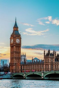 the big ben clock tower towering over the city of london, england at sunset or dawn