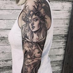 a woman with a tattoo on her arm