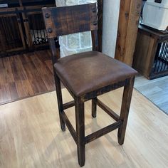 a wooden chair sitting on top of a hard wood floor