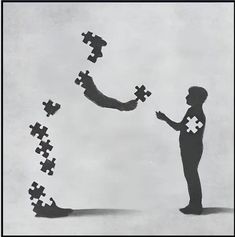 a man standing in front of a group of puzzle pieces with one holding the other's hand