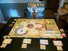 the board game tolkin is displayed on a table