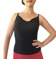 "Classic, all-around cami showcases your fabulous skirts and pants. Draped front and back necklines. Partially lined bodice. 5\" spaghetti straps work with most bras. Item #TL202. Soft, silky and stretchy poly/spandex jersey. Size: -Sizes 4 through 16 Fabric & Care: -Easy care, no-wrinkle poly/spandex -Hand wash cold. Hang dry. Overview: -Great for travel - rolls up small. -Handmade in our studio in Santa Fe, New Mexico USA. Questions about fabric, fit or size? Email me. I am delighted to he Fitted V-neck Camisole With Adjustable Straps, Fitted Camisole With Built-in Bra For Evening, Black Tops With Built-in Bra And Fitted Bodice, Fitted Cami Tank Top With Built-in Bra, Fitted V-neck Top With Lined Body, Elastane Camisole With Built-in Bra For Night Out, Elegant Tank Top With Built-in Bra And Wide Straps, Fitted Camisole With Built-in Bra, Stretch Sleeveless Halter Top With Built-in Bra