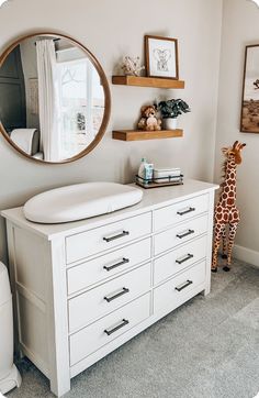 Neutral nursery decor. Safari nursery. Neutral home inspo. Baby’s room. Changing table ideas Dressers In Nursery, Changing Table With Mirror, Shelves Above Changing Table Dressers, Neutral Nursery Changing Tables, Clean Nursery Ideas, Botanical Nursery Ideas, Wall Decor Above Changing Table, Changing Table On Dresser, Above Nursery Dresser Decor