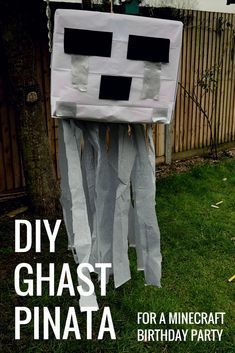 a homemade paper mache costume made to look like a face for a minecraft birthday party